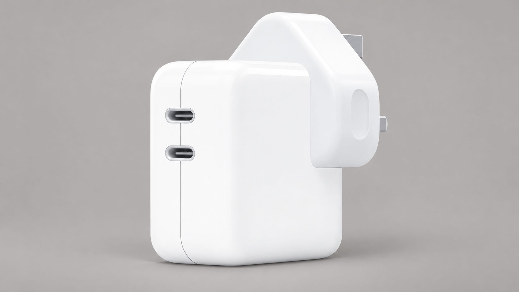 Editorial illustration of Apple 35W Dual USB-C Port Power Adapter MW2K3B/A, UK; visible model recognition only, not a technical or complete-pack diagram.