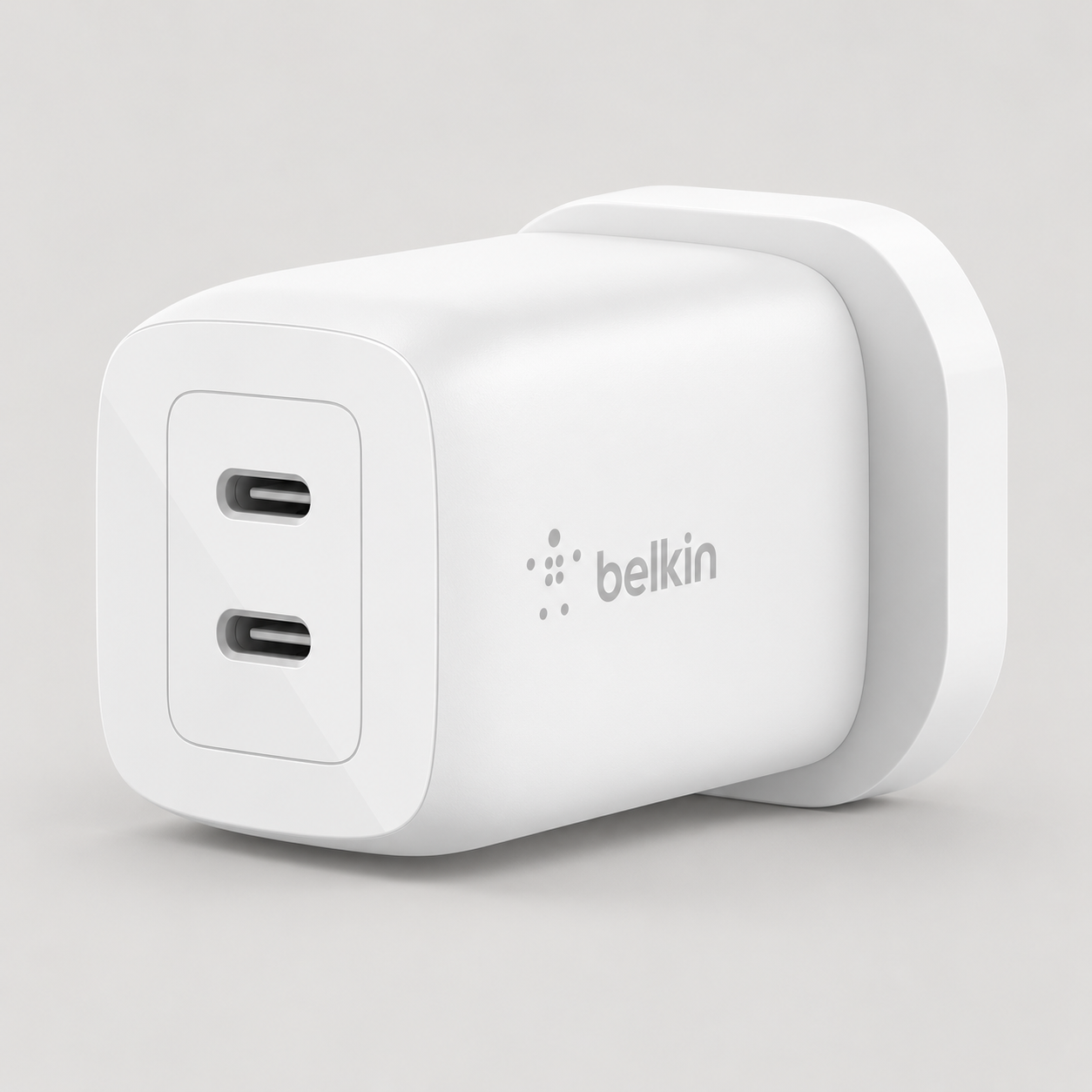 Editorial illustration of Belkin WCH013myWH, white UK 65W dual USB-C charger; visible model recognition only, not a technical or complete-pack diagram.