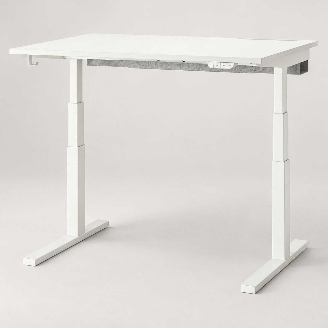 Editorial illustration of the white IKEA MITTZON 195.275.73 desk and T-shaped feet; mains connections not shown.
